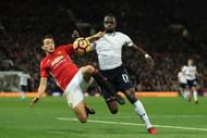 MANCHESTER, ENGLAND - DECEMBER 11: Moussa Sissoko of Tottenham Hotspur and Matteo Darmian of Manchester United compete for the ball during the Premier League match between Manchester United and Tottenham Hotspur at Old Trafford on December 11, 2016 in Manchester, England.  (Photo by Richard Heathcote/Getty Images)